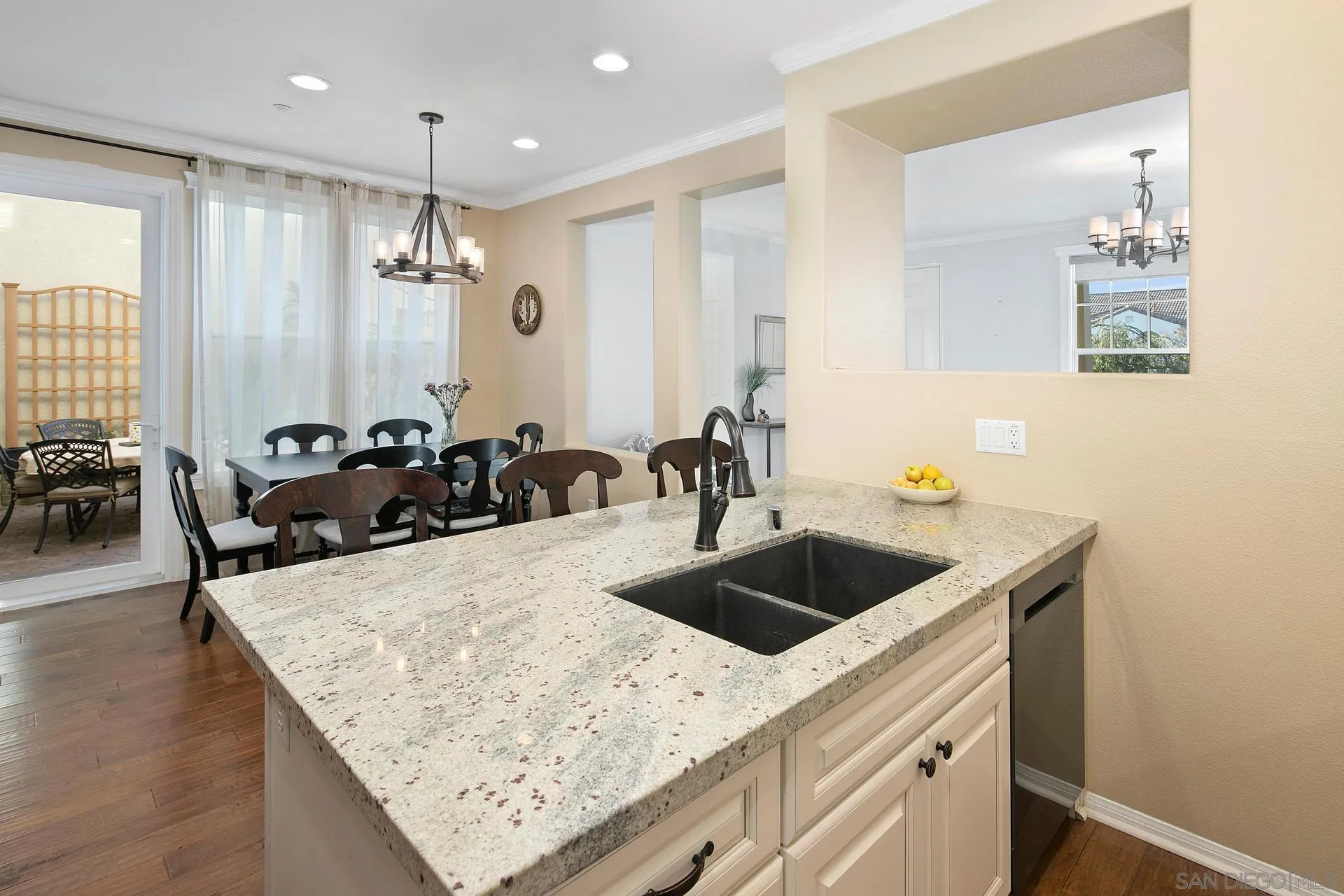 16633 Deer Ridge Road San Diego, CA 92127 - Photo 13 of 53 a kitchen with a sink a counter and chairs