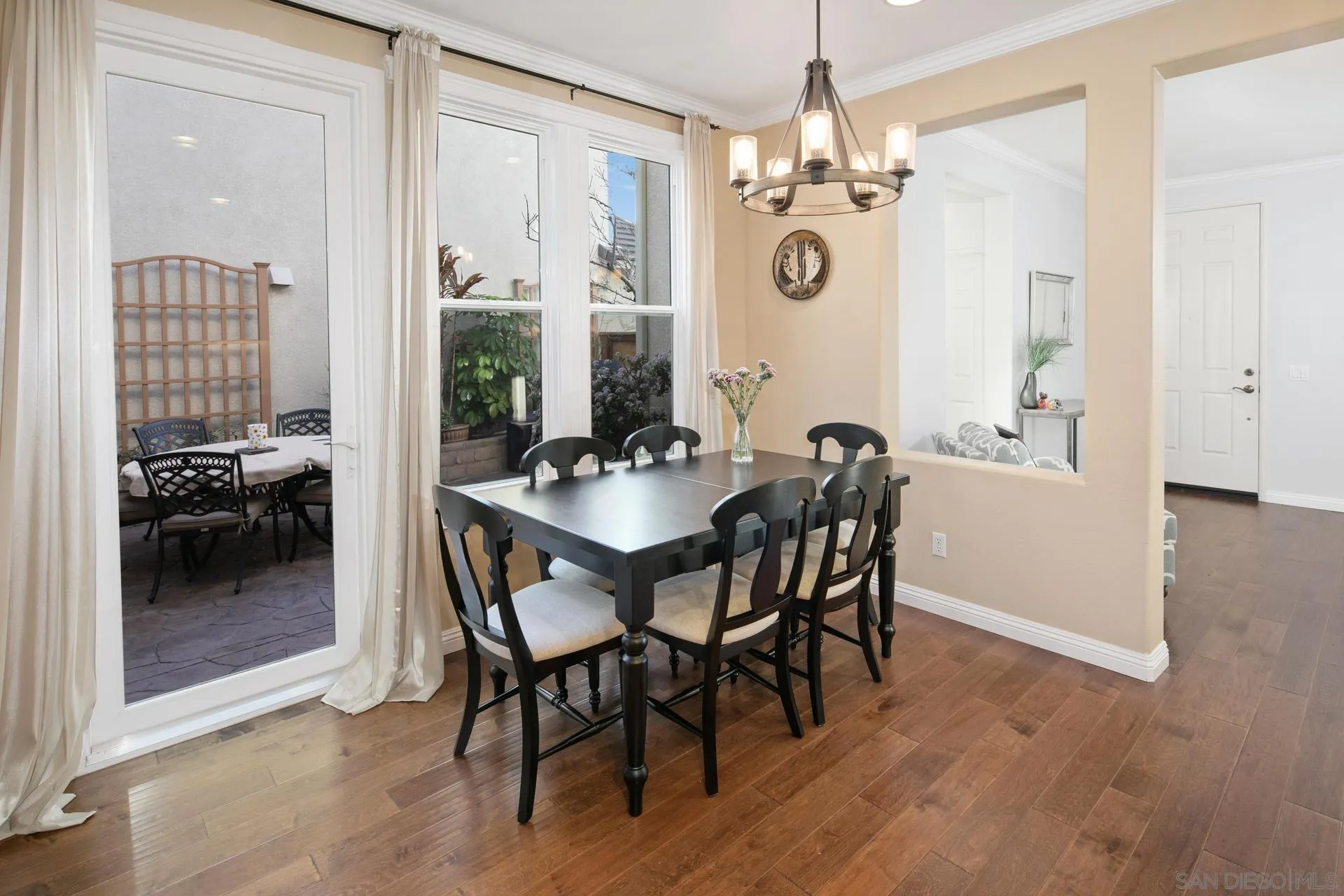 16633 Deer Ridge Road San Diego, CA 92127 - Photo 14 of 53 a view of a dining room with furniture wooden floor and chandelier