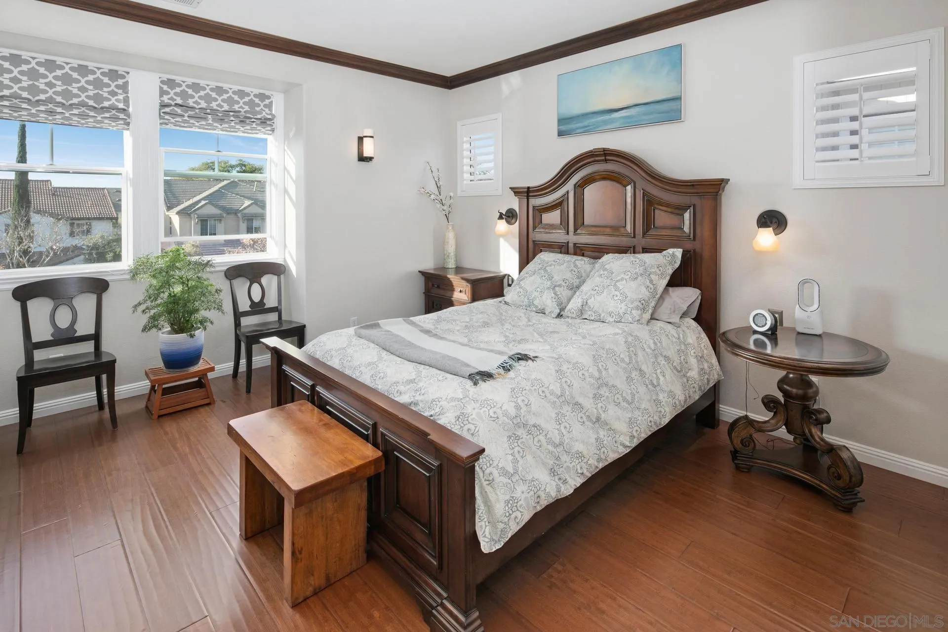 16633 Deer Ridge Road San Diego, CA 92127 - Photo 19 of 53 a bedroom with a bed a table and a potted plant on table