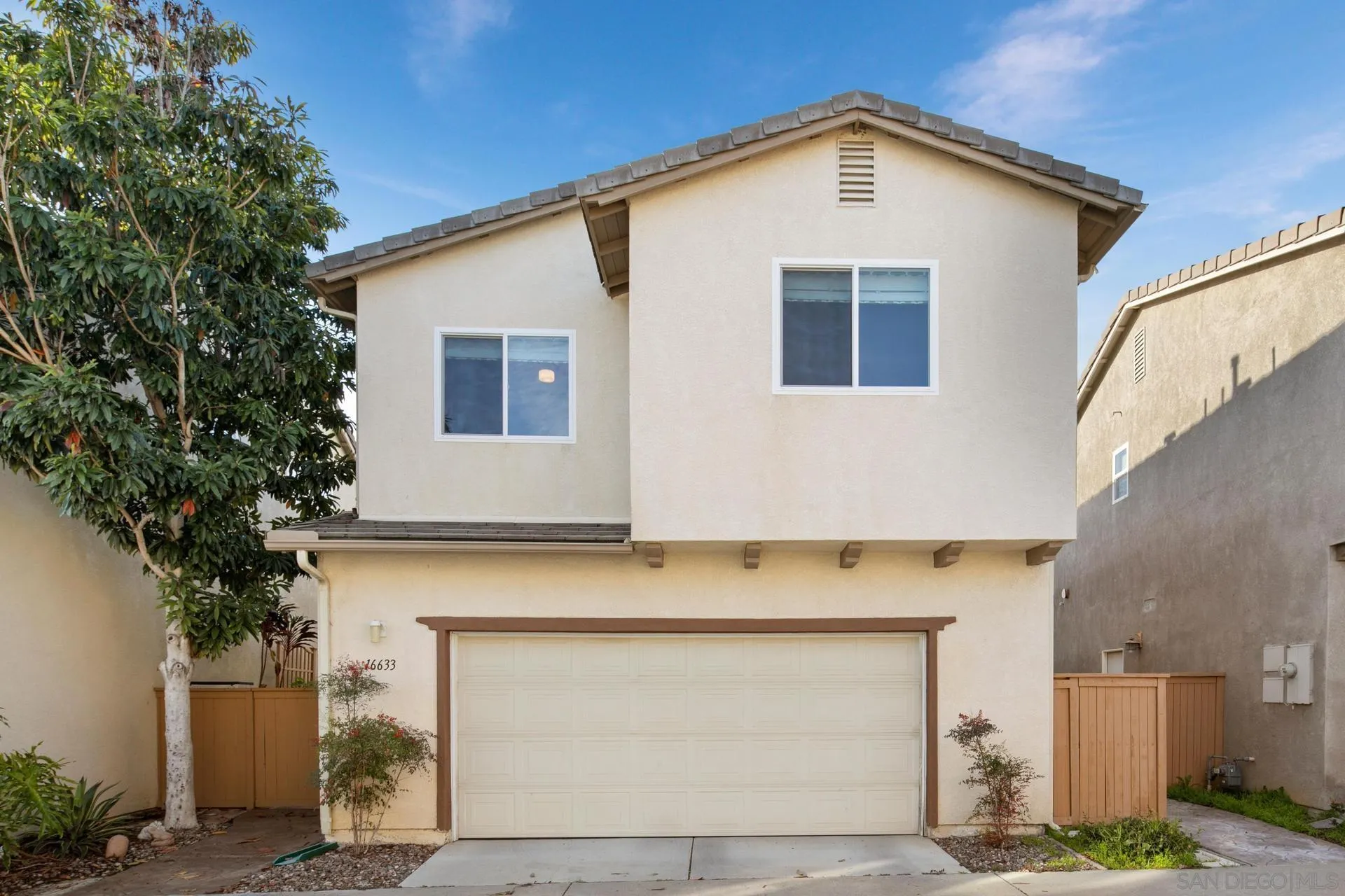16633 Deer Ridge Road San Diego, CA 92127 - Photo 32 of 53 a front view of a house with garage