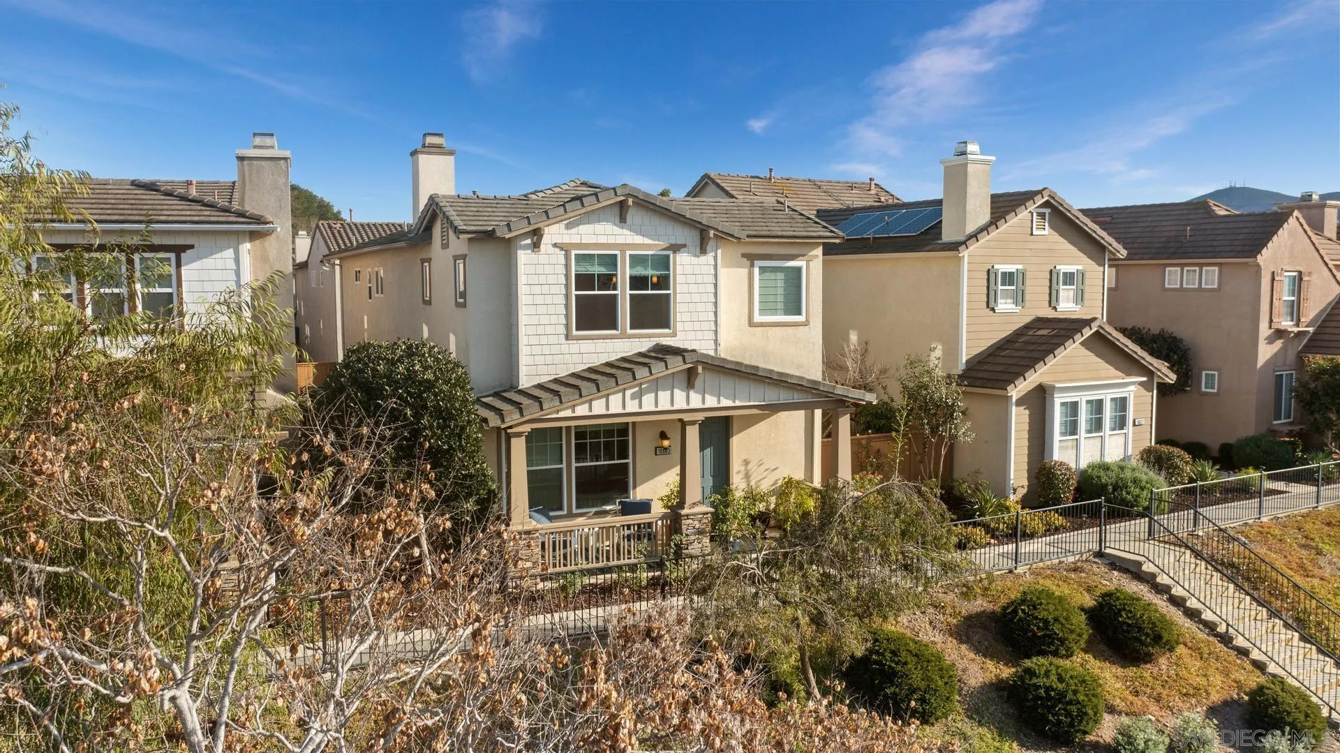 16633 Deer Ridge Road San Diego, CA 92127 - Photo 4 of 53 a front view of a house with a yard