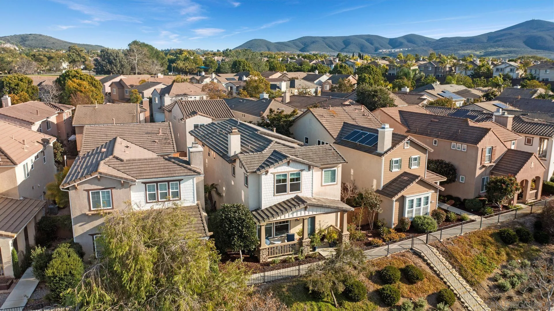 16633 Deer Ridge Road San Diego, CA 92127 - Photo 50 of 53 an aerial view of a residential apartment building with a mountain in the background