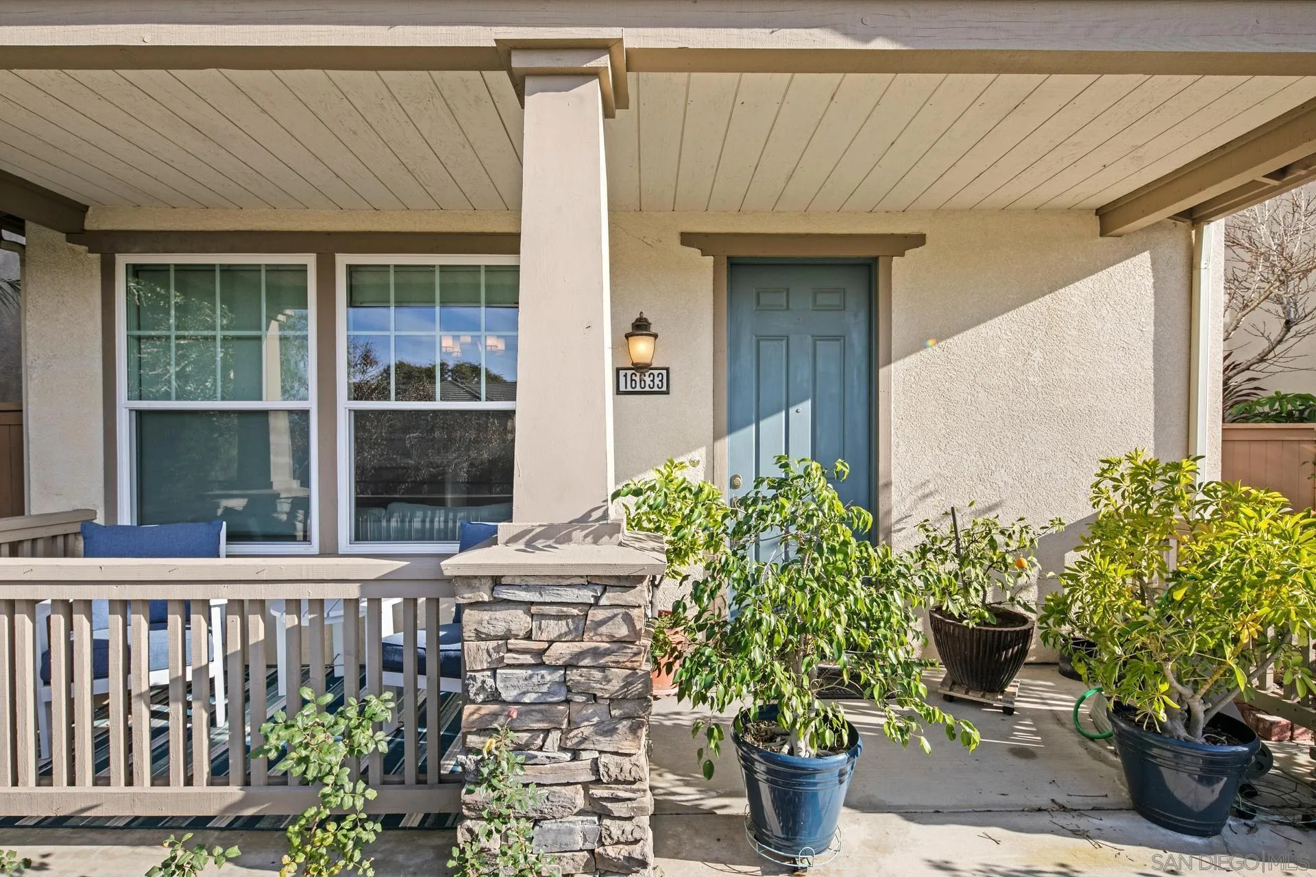 16633 Deer Ridge Road San Diego, CA 92127 - Photo 51 of 53 a front view of a house with potted plants