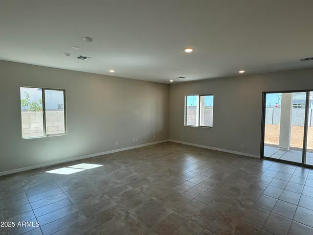 a view of an empty room with windows