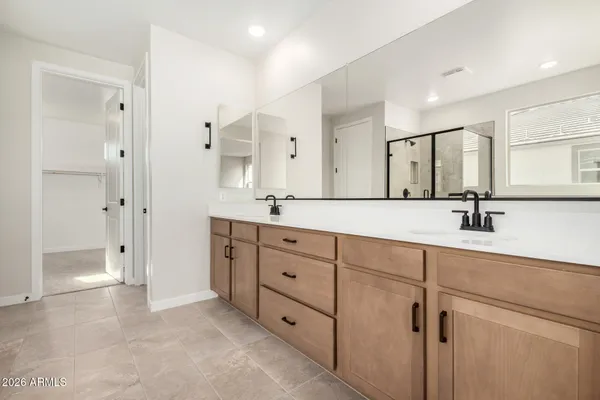 a spacious bathroom with a bathtub and a shower