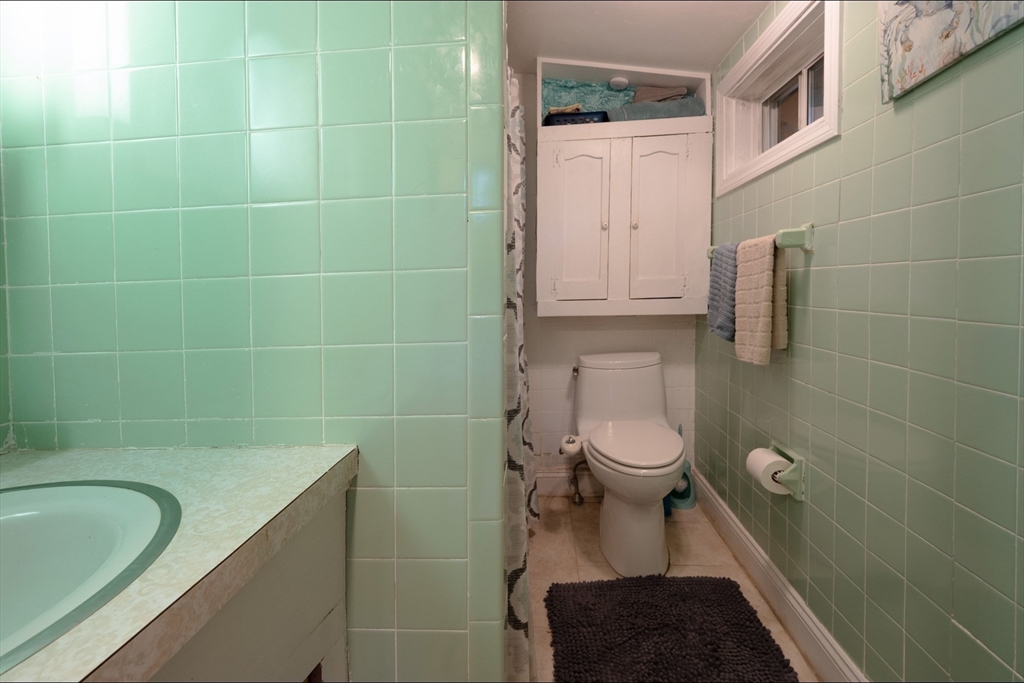 9 Overbrook Road Pembroke, MA 02359 - Photo 20 of 21 a bathroom with a granite countertop toilet and a sink