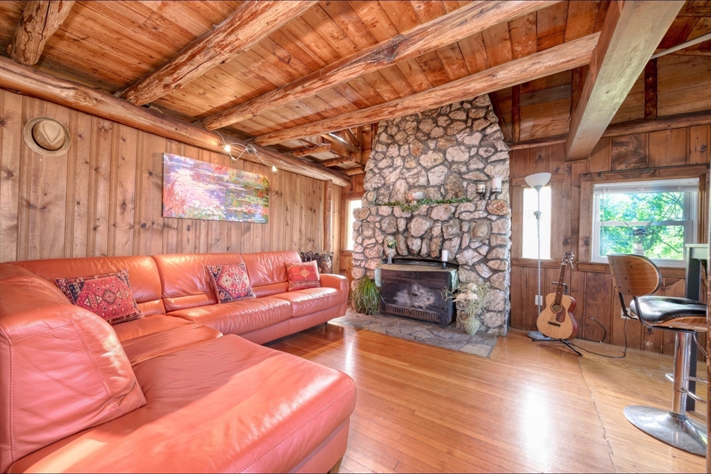 9 Overbrook Road Pembroke, MA 02359 - Photo 10 of 21 a living room with furniture and a fireplace