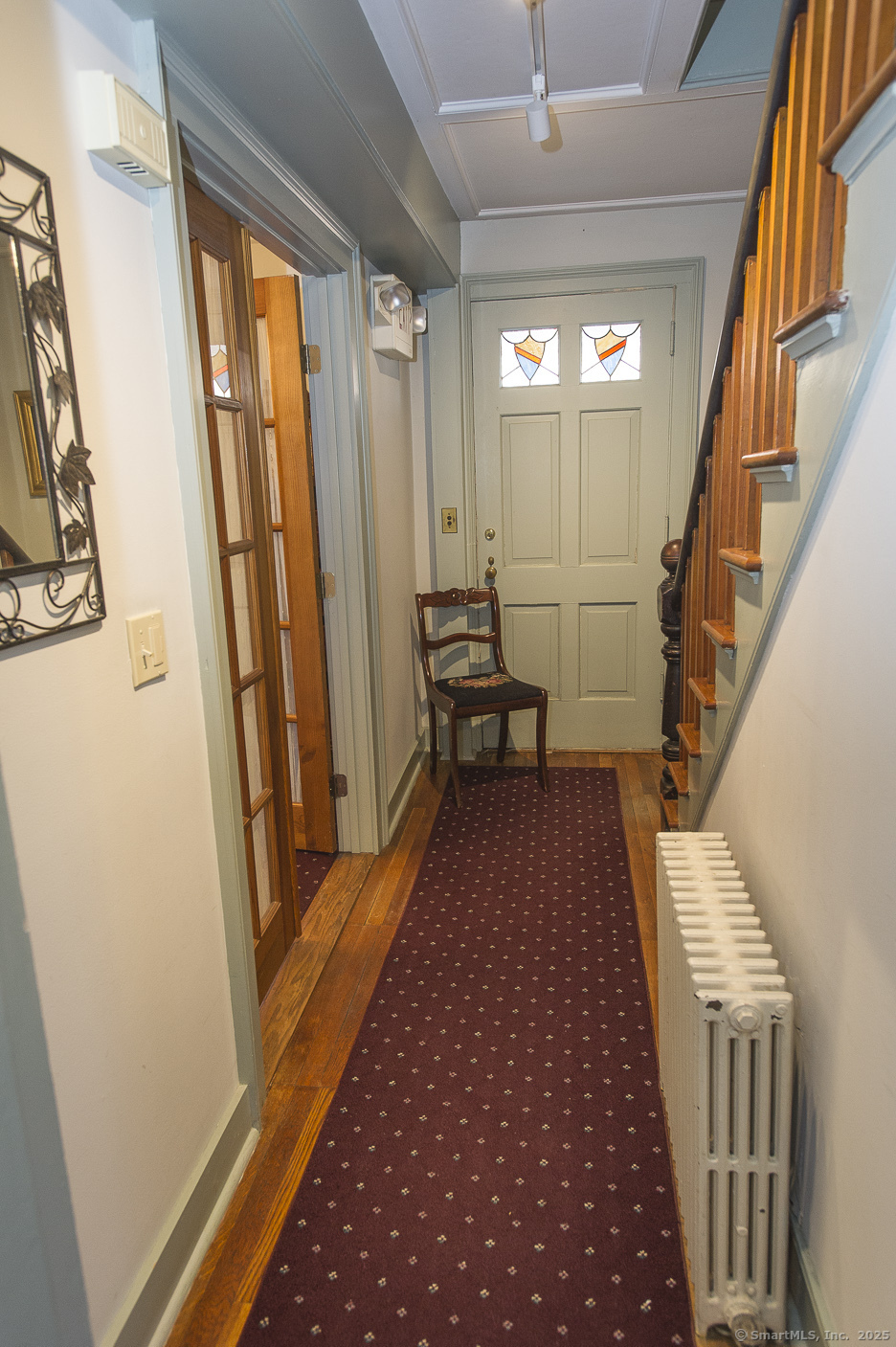 74 Park Lane Road New Milford, CT 06776 - Photo 11 of 22 a view of a hallway with wooden floor and stairs