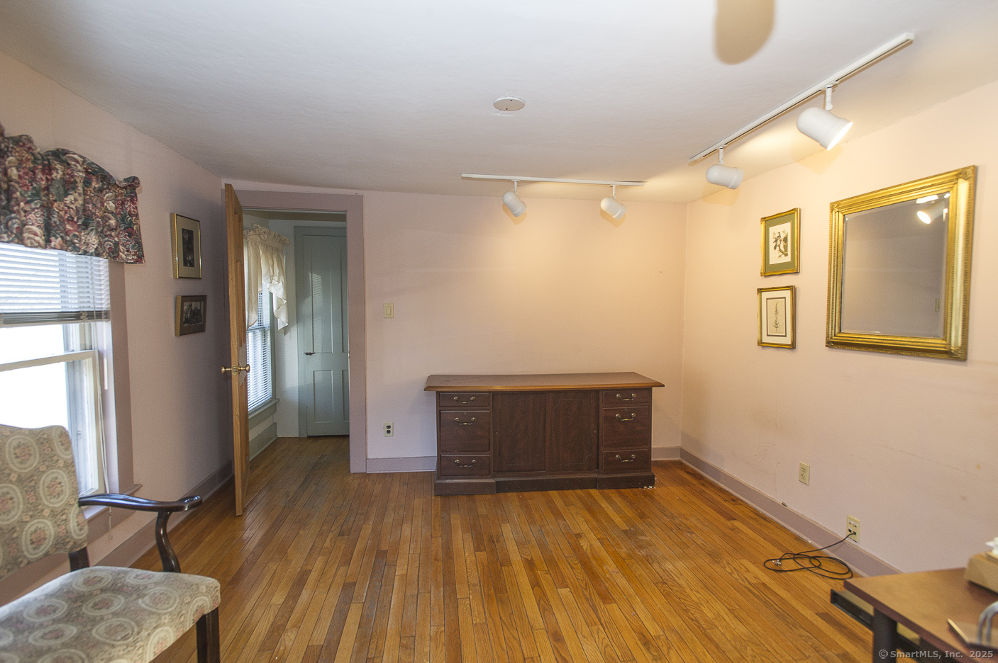 74 Park Lane Road New Milford, CT 06776 - Photo 13 of 22 a room with a bed and wooden floor
