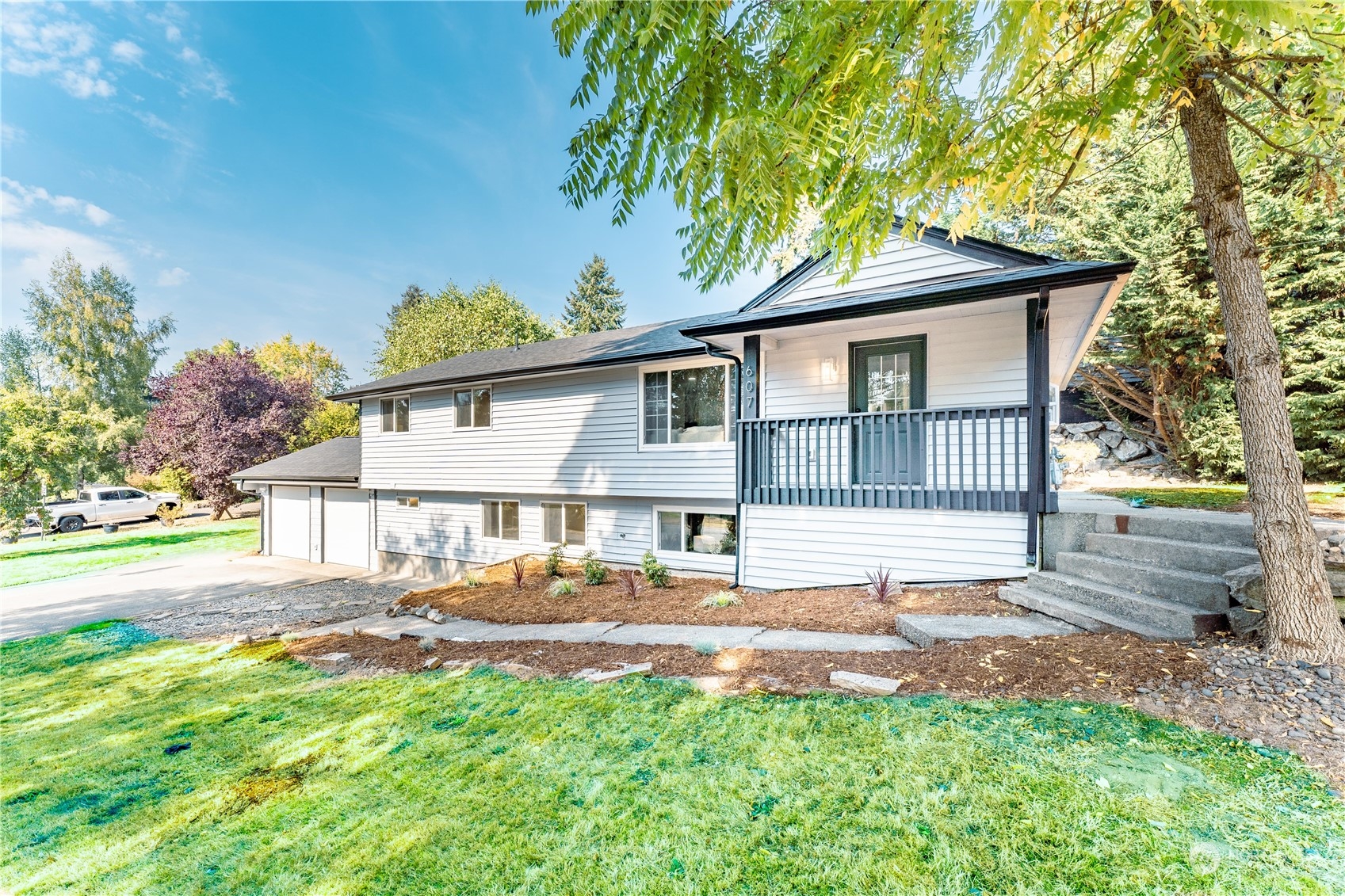 607 244th Street Southwest Bothell, WA 98021 - Photo 1 of 1 a front view of a house with garden