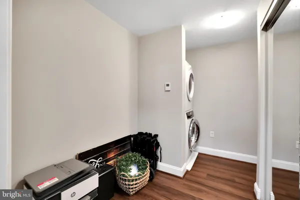 a view of an entryway with wooden floor