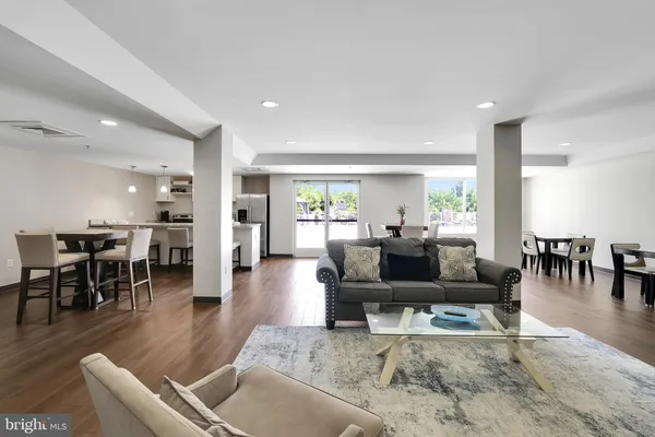 a living room with furniture and a table