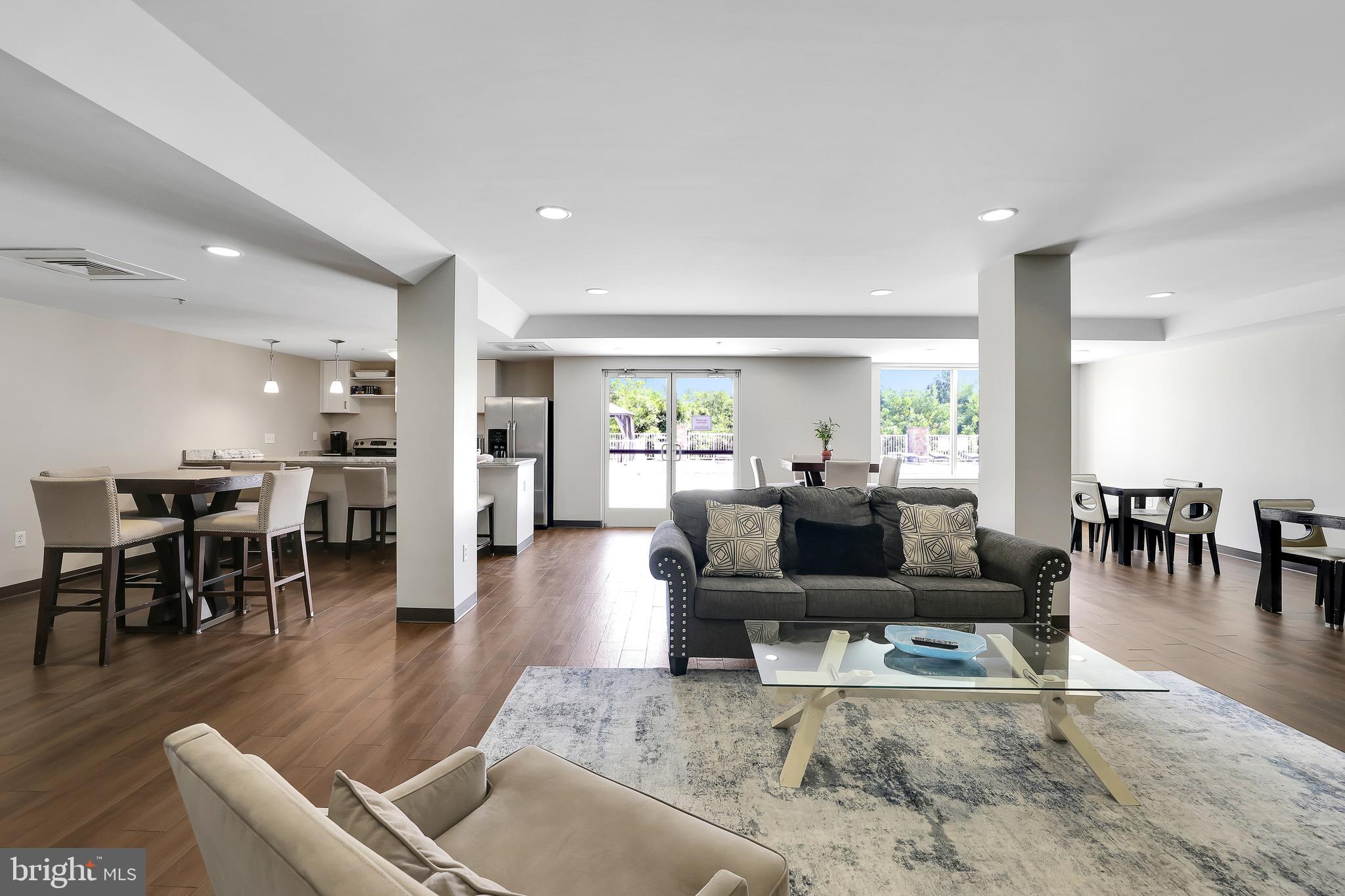 6301 Edsall Road, Unit 104 Alexandria, VA 22312 - Photo 21 of 28 a living room with furniture and a table