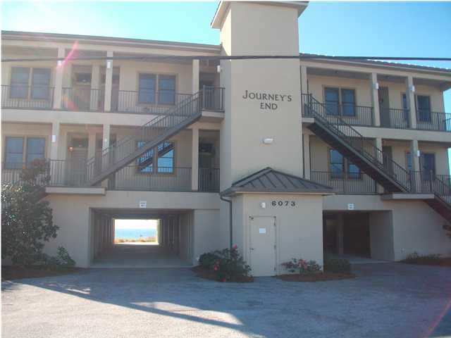 6073 West C30a Santa Rosa Beach, Unit 101 Santa Rosa Beach, FL 32459 - Photo 2 of 15 a front view of a house with garage