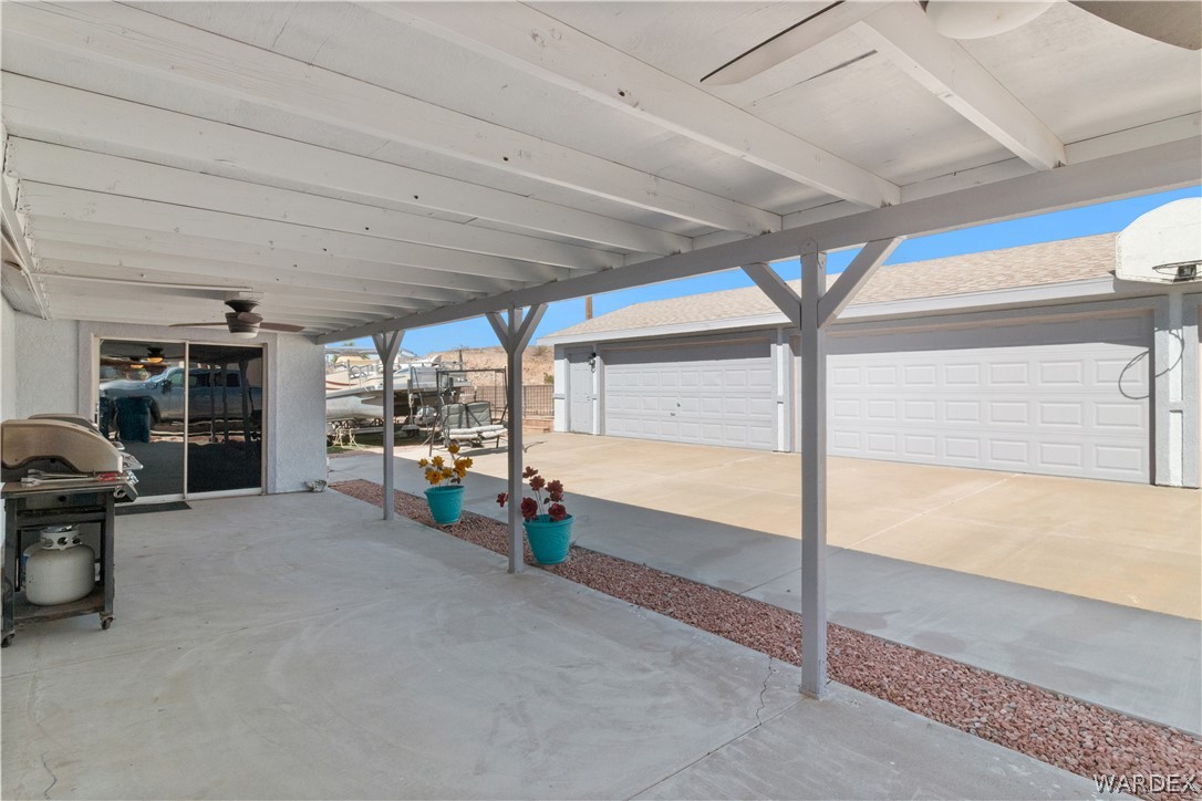 784 Pegasus Ranch Road Bullhead City, AZ 86429 - Photo 74 of 100 Covered patio with concrete flooring, supported by white-painted beams