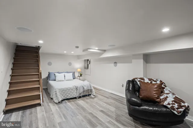 a living room with a furniture and a dresser