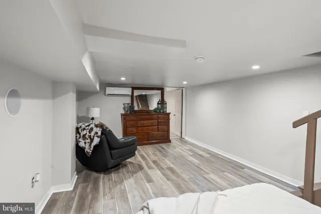 a kitchen with stainless steel appliances granite countertop a sink a stove a refrigerator and cabinets