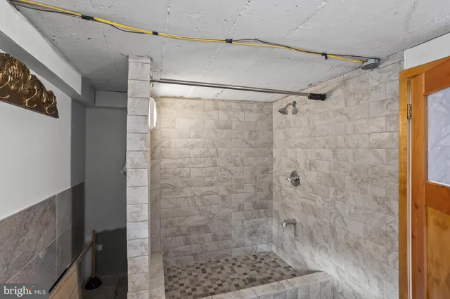 a view of porch with wooden stairs