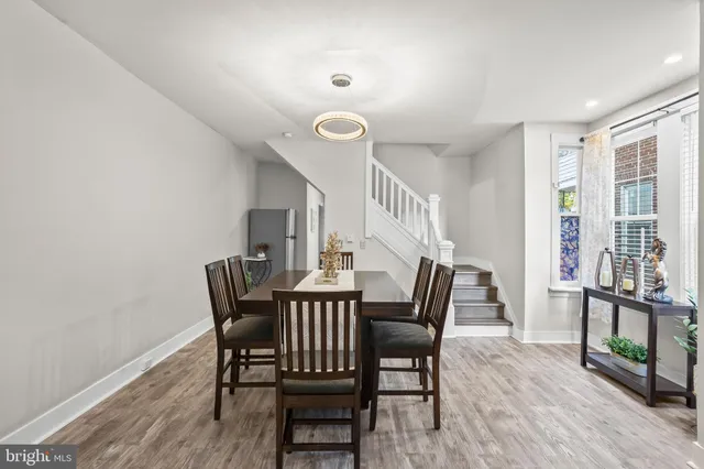 a view of a dining room with furniture and a window