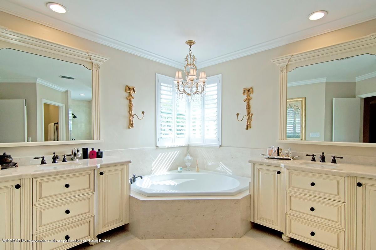 338 Southwest 16th Street Boca Raton, FL 33432 - Photo 15 of 31 a bathroom with a tub sink mirror and window