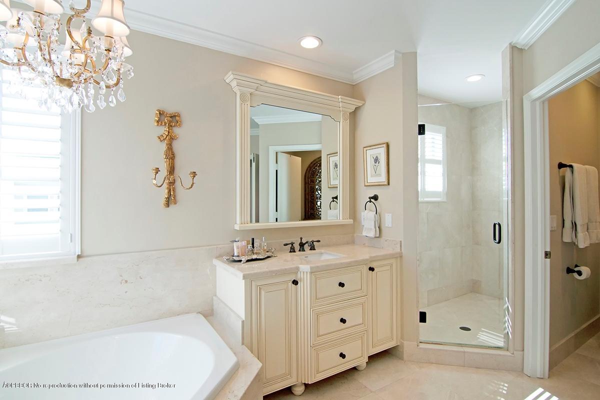 338 Southwest 16th Street Boca Raton, FL 33432 - Photo 17 of 31 a bathroom with a double vanity sink mirror and shower