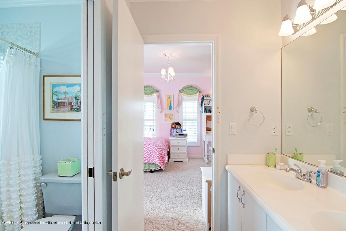 338 Southwest 16th Street Boca Raton, FL 33432 - Photo 19 of 31 a bathroom with a sink vanity mirror and toilet