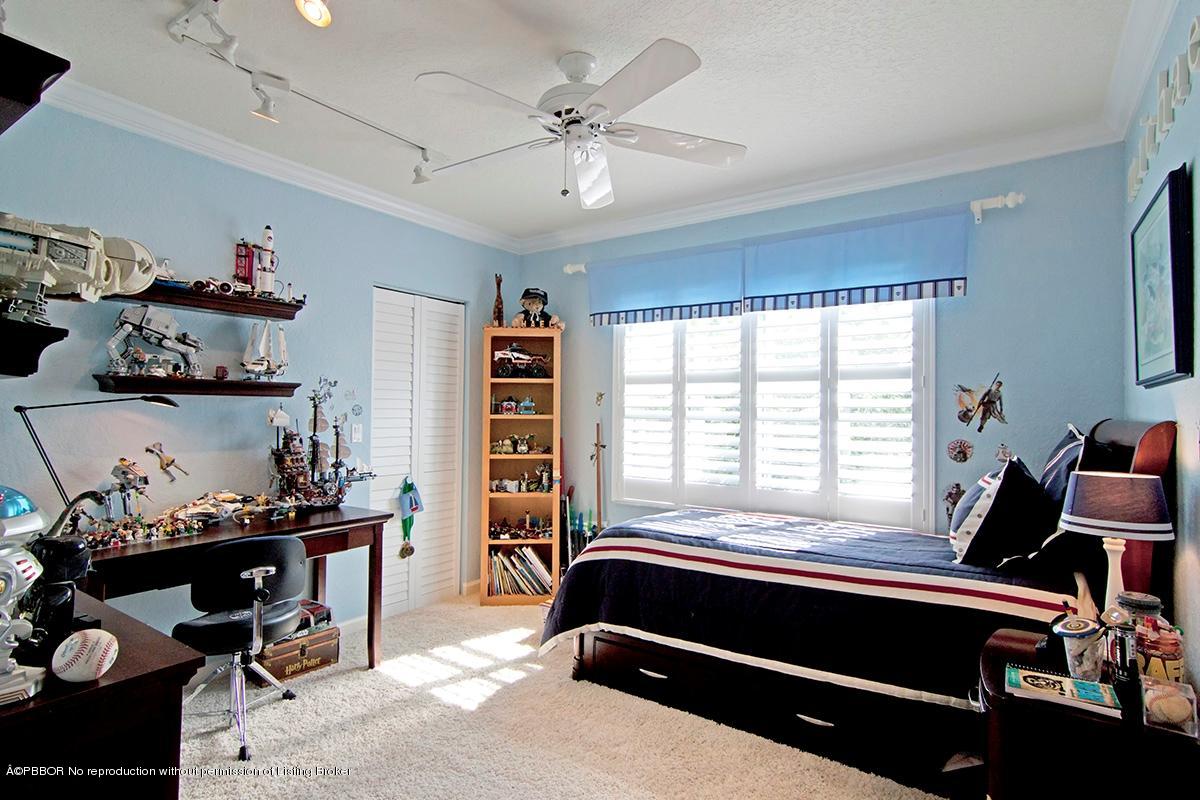 338 Southwest 16th Street Boca Raton, FL 33432 - Photo 21 of 31 a bedroom with a workspace