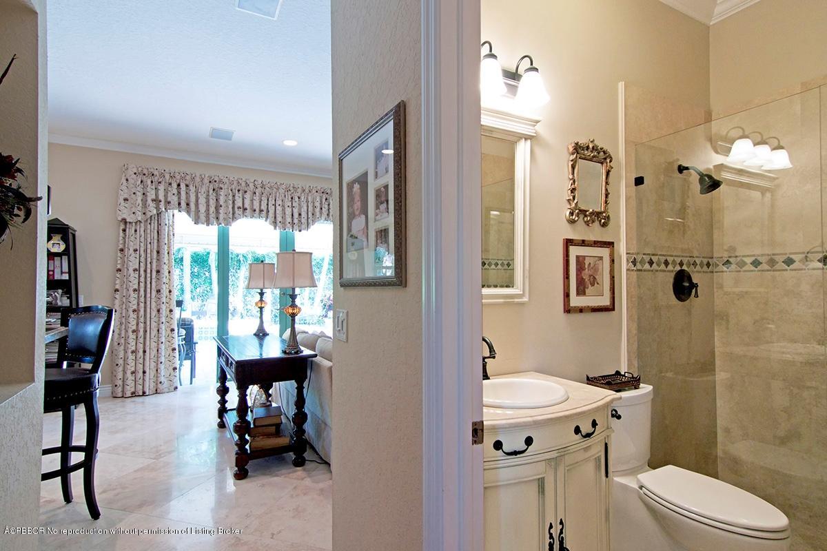 338 Southwest 16th Street Boca Raton, FL 33432 - Photo 26 of 31 a bathroom with a sink toilet and shower