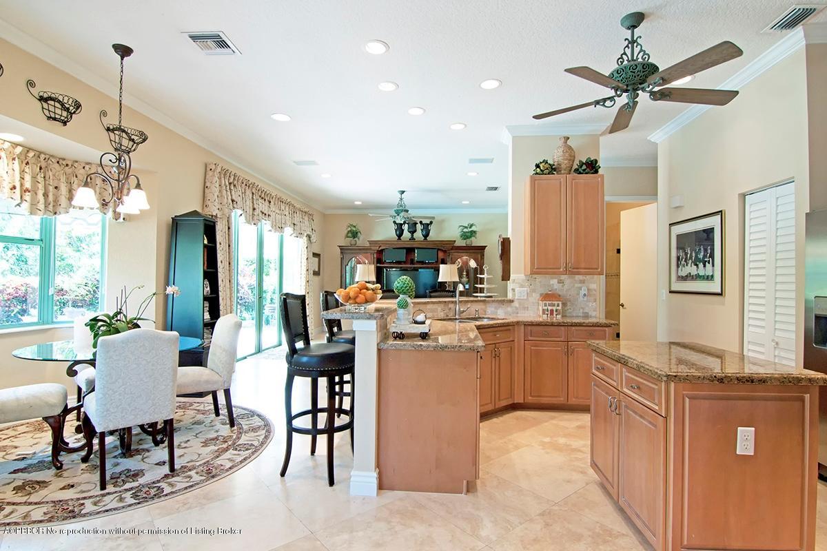 338 Southwest 16th Street Boca Raton, FL 33432 - Photo 4 of 31 a kitchen with cabinets and chairs