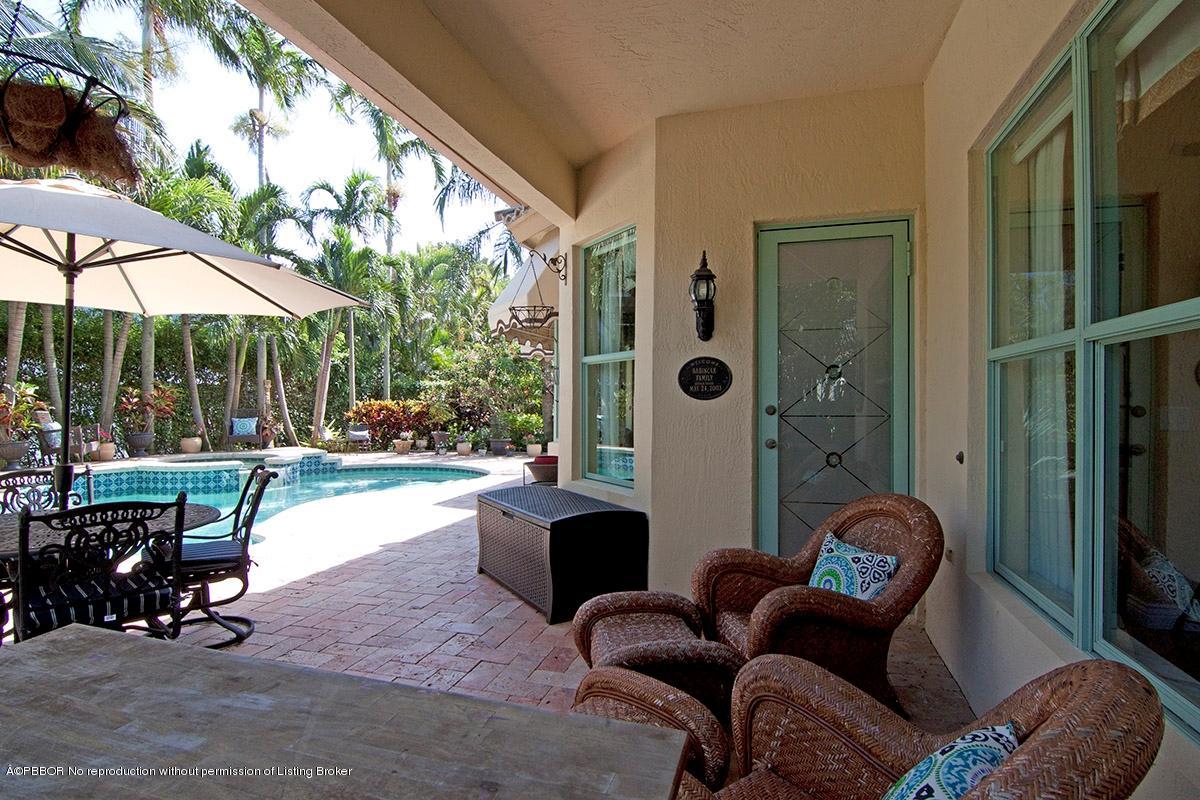338 Southwest 16th Street Boca Raton, FL 33432 - Photo 31 of 31 a living room filled with furniture and a chandelier