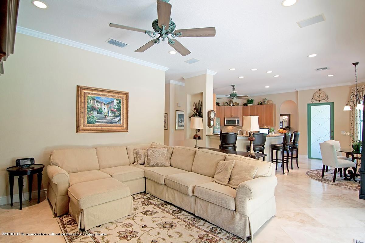 338 Southwest 16th Street Boca Raton, FL 33432 - Photo 9 of 31 a living room with furniture kitchen view and a chandelier