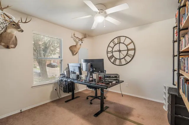 a living room with furniture a window and a chandelier