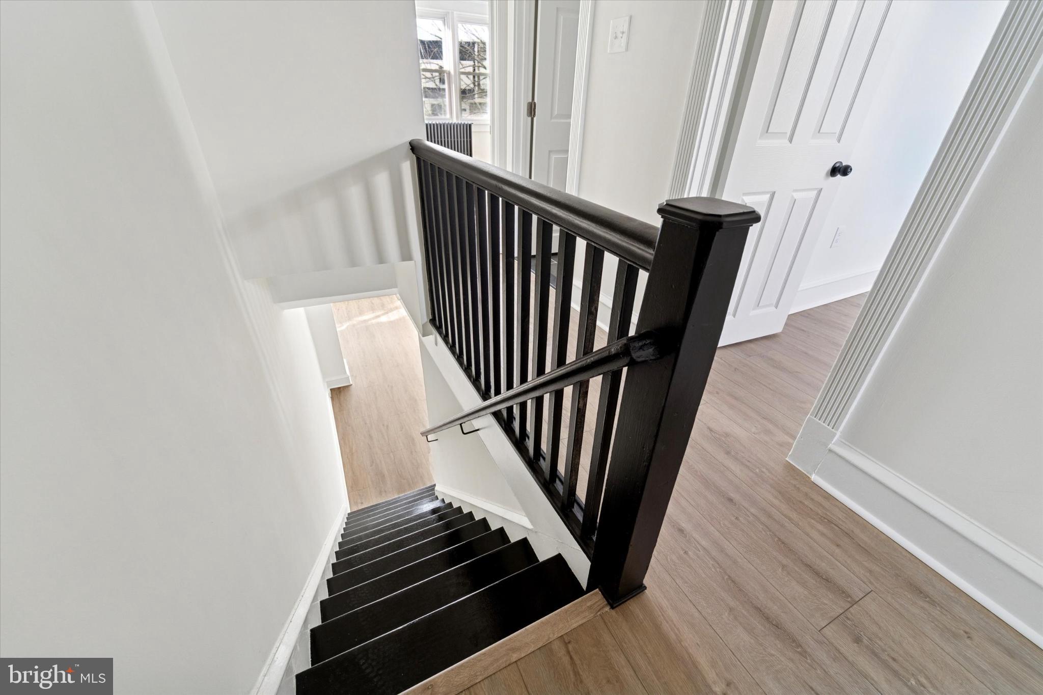247 Coverly Road Lansdowne, PA 19050 - Photo 11 of 25 a view of staircase with wooden floor and white walls