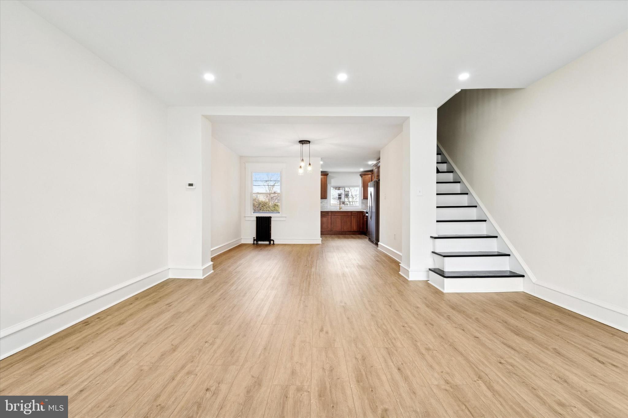 247 Coverly Road Lansdowne, PA 19050 - Photo 15 of 25 a view of an empty room with wooden floor and stairs