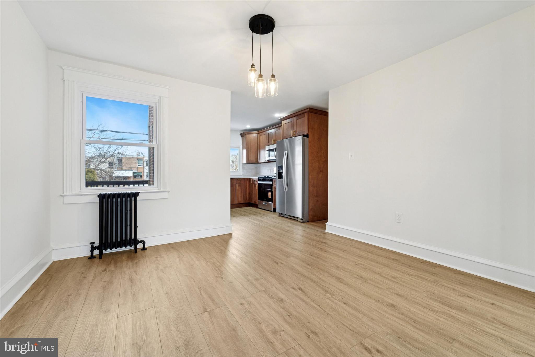 247 Coverly Road Lansdowne, PA 19050 - Photo 16 of 25 a view of an empty room with a window and wooden floor