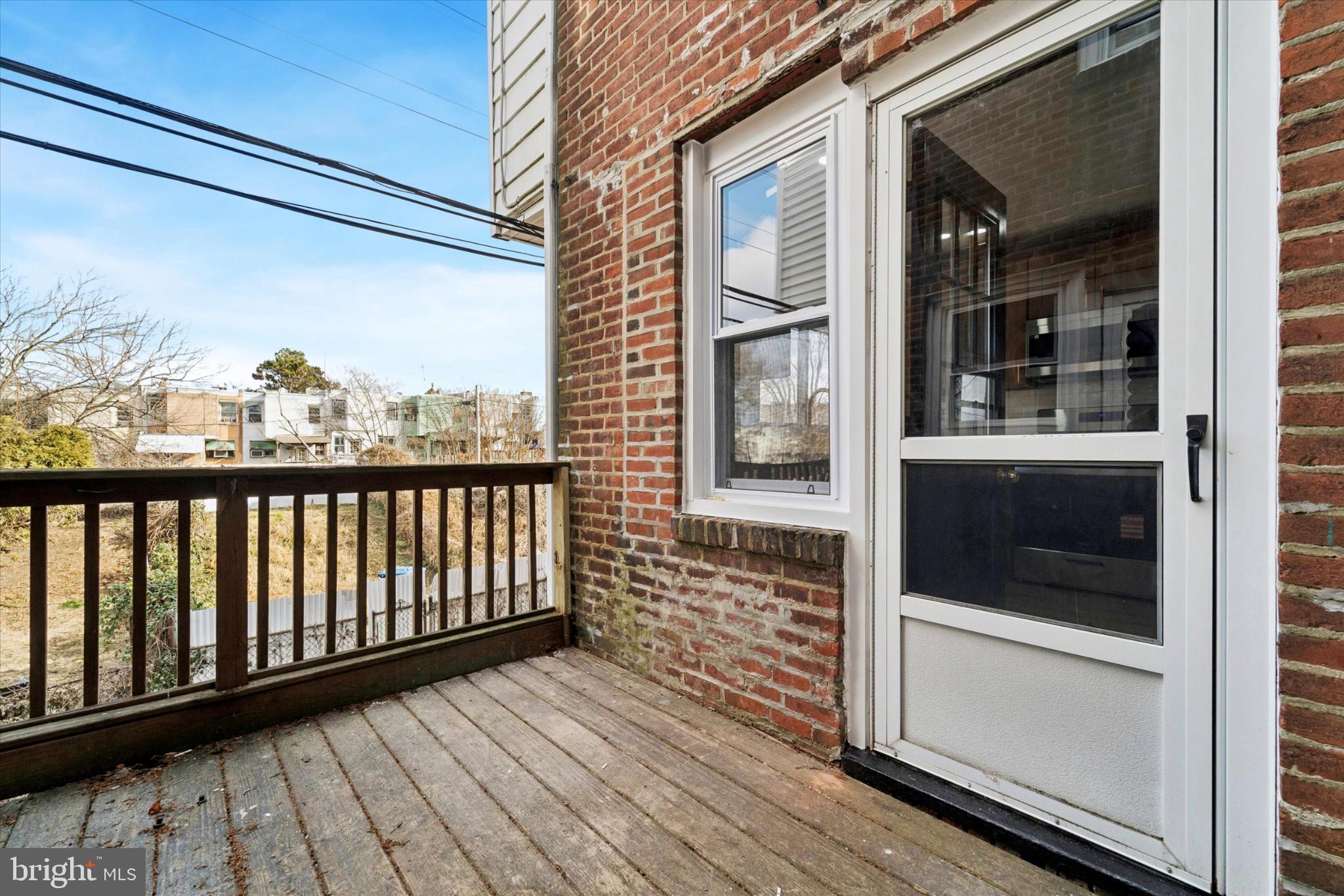 247 Coverly Road Lansdowne, PA 19050 - Photo 19 of 25 a view of a balcony with wooden floor and fence