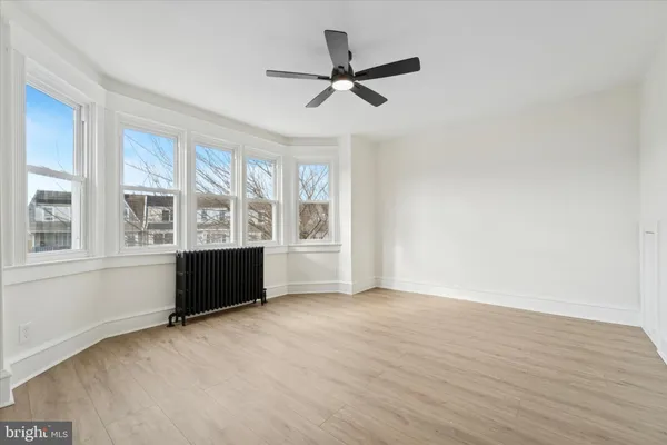 a view of an empty room with a window