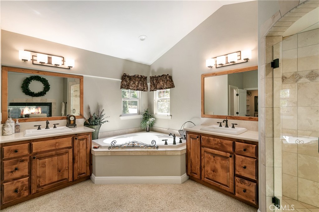 28449 Fresh Spring Lane Lake Arrowhead, CA 92352 - Photo 28 of 55 a bathroom with a double vanity sink mirror and bathtub