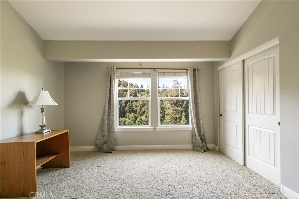 28449 Fresh Spring Lane Lake Arrowhead, CA 92352 - Photo 36 of 55 a view of an empty room with a window