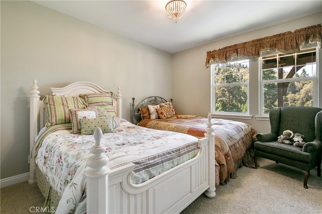 28449 Fresh Spring Lane Lake Arrowhead, CA 92352 - Photo 42 of 55 a bedroom with a bed and a window