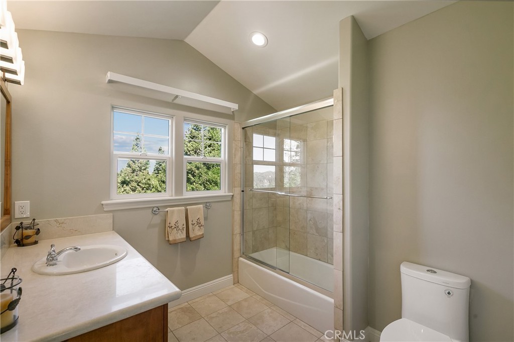 28449 Fresh Spring Lane Lake Arrowhead, CA 92352 - Photo 47 of 55 a bathroom with a sink a toilet and tub