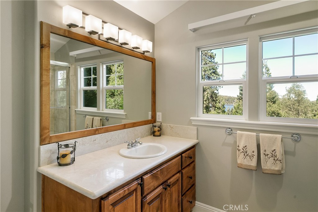 28449 Fresh Spring Lane Lake Arrowhead, CA 92352 - Photo 48 of 55 a bathroom with a sink and a mirror