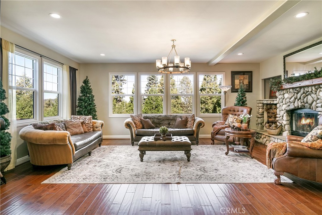 28449 Fresh Spring Lane Lake Arrowhead, CA 92352 - Photo 8 of 55 a living room with furniture and a fireplace