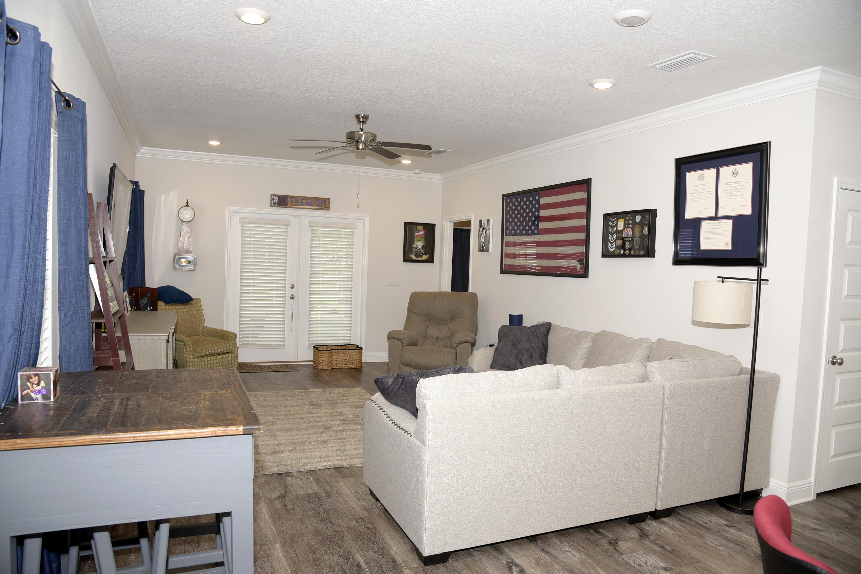 328 Lightning Bug Lane Freeport, FL 32439 - Photo 11 of 43 a living room with furniture and a flat screen tv