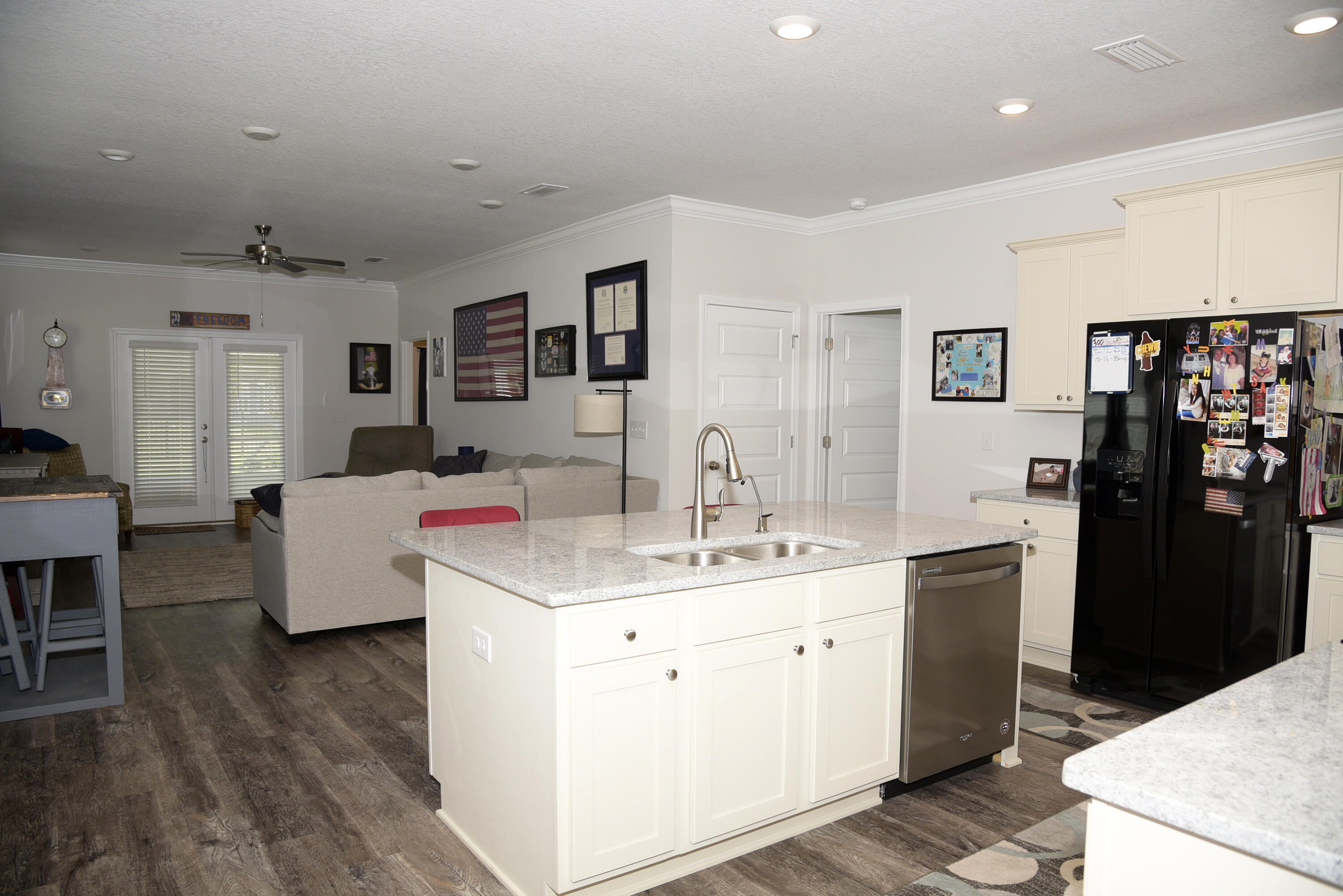 328 Lightning Bug Lane Freeport, FL 32439 - Photo 12 of 43 a living room with a sink and a refrigerator