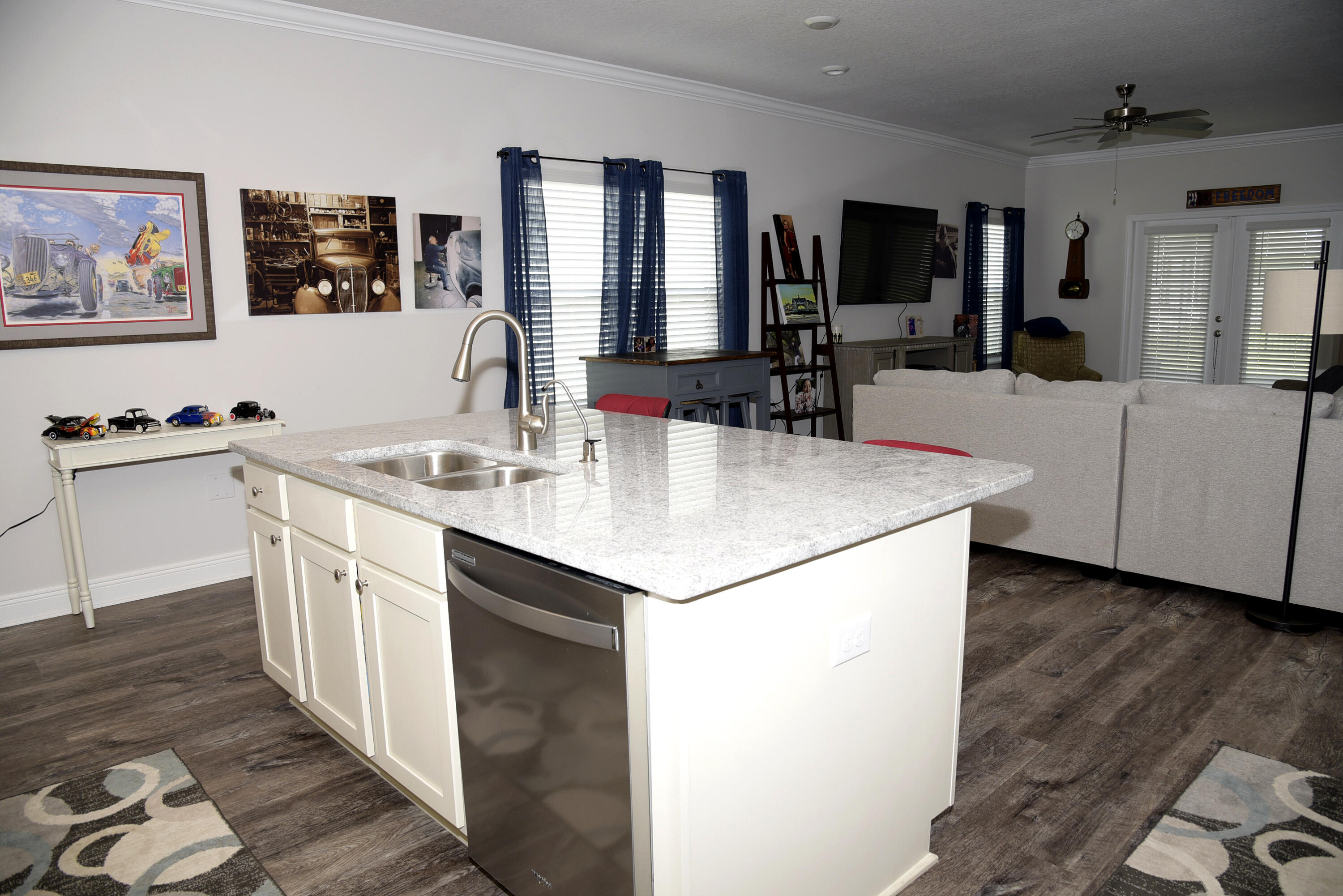 328 Lightning Bug Lane Freeport, FL 32439 - Photo 14 of 43 a kitchen with a sink and a refrigerator