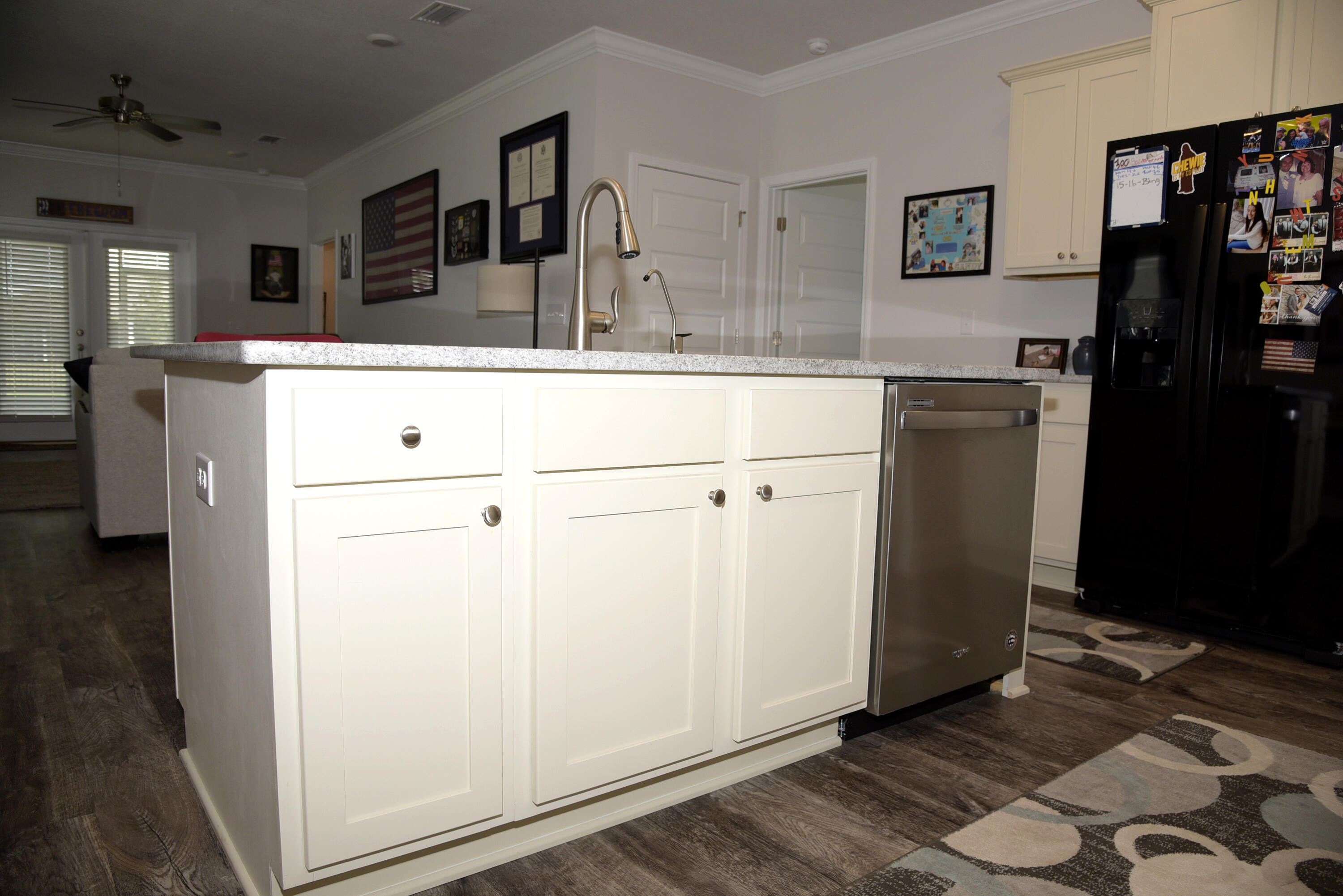 328 Lightning Bug Lane Freeport, FL 32439 - Photo 15 of 43 a kitchen with a refrigerator and a sink