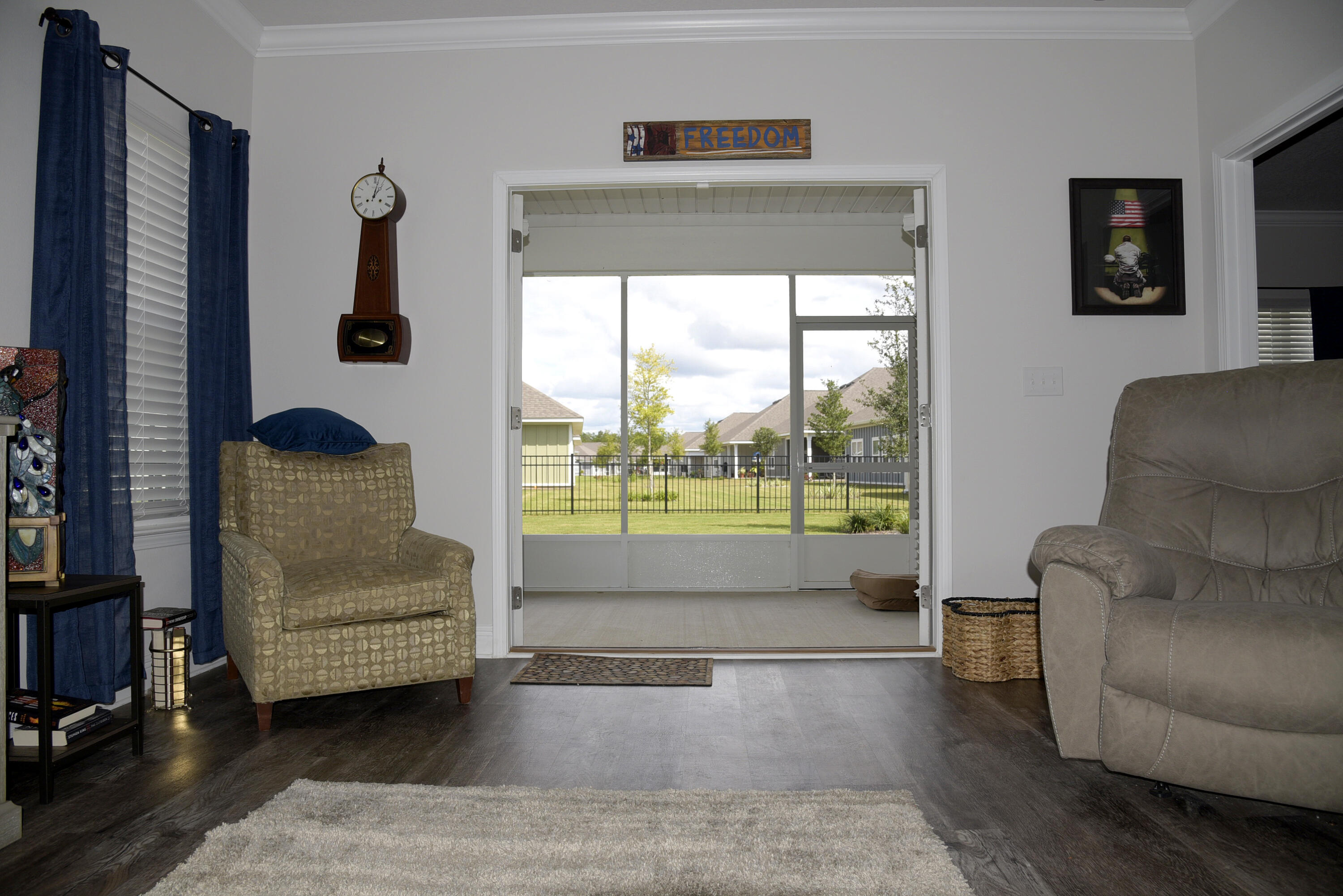 328 Lightning Bug Lane Freeport, FL 32439 - Photo 19 of 43 a living room with furniture and a floor to ceiling window