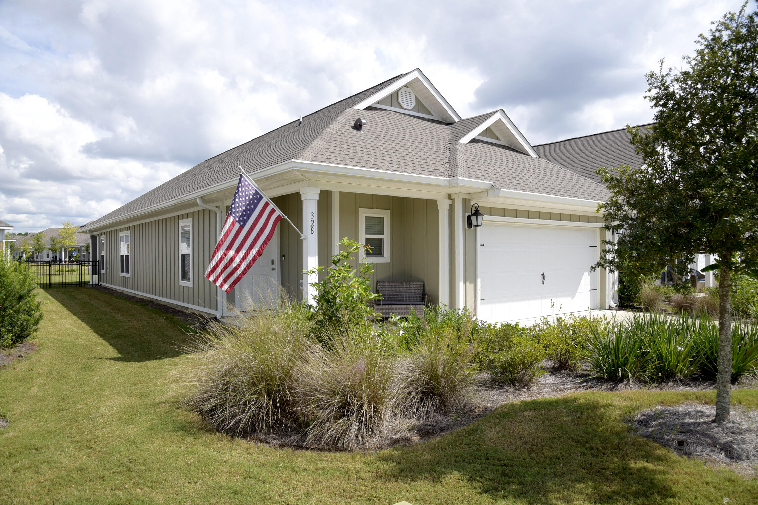 328 Lightning Bug Lane Freeport, FL 32439 - Photo 2 of 43 a front view of house with yard and trees