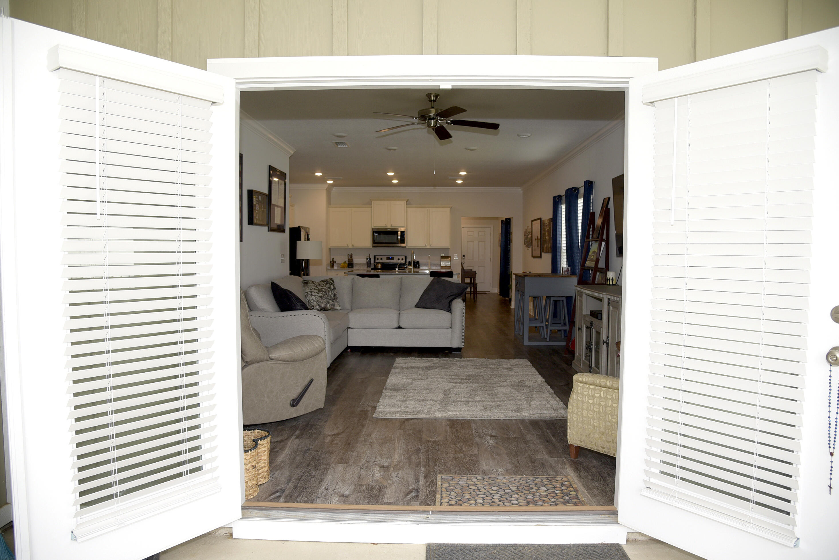 328 Lightning Bug Lane Freeport, FL 32439 - Photo 21 of 43 a view of a living room and kitchen with furniture and a window